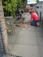 Re-laying of uneven paving slabs.